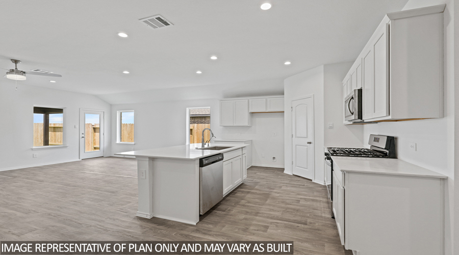 Kitchen with island and stainless-steel appliances.