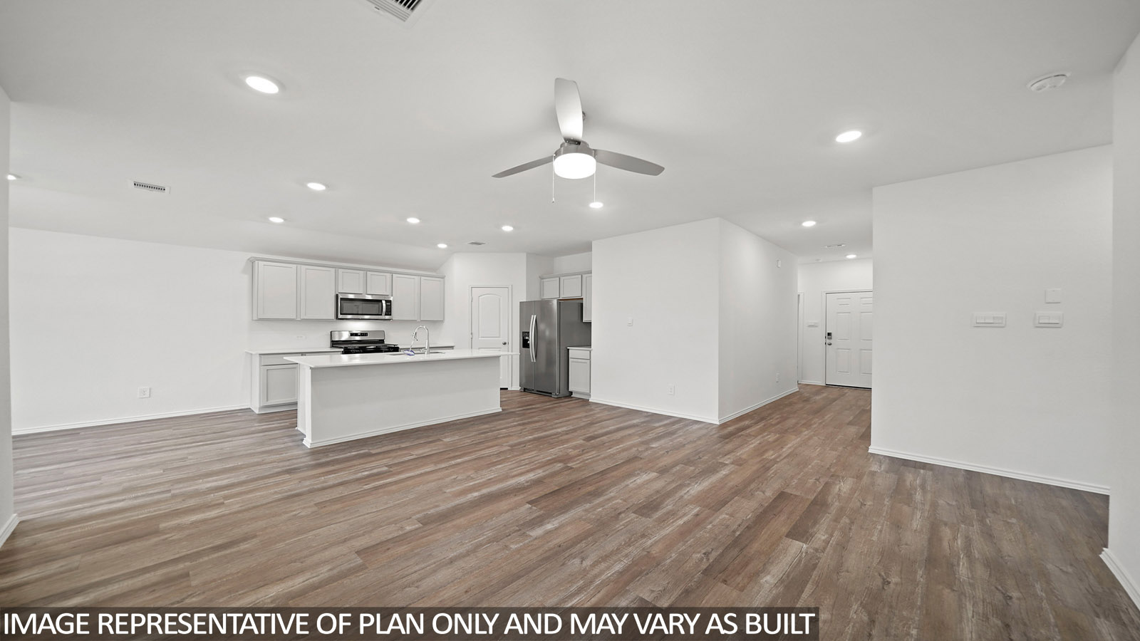 Spacious living area with vinyl flooring