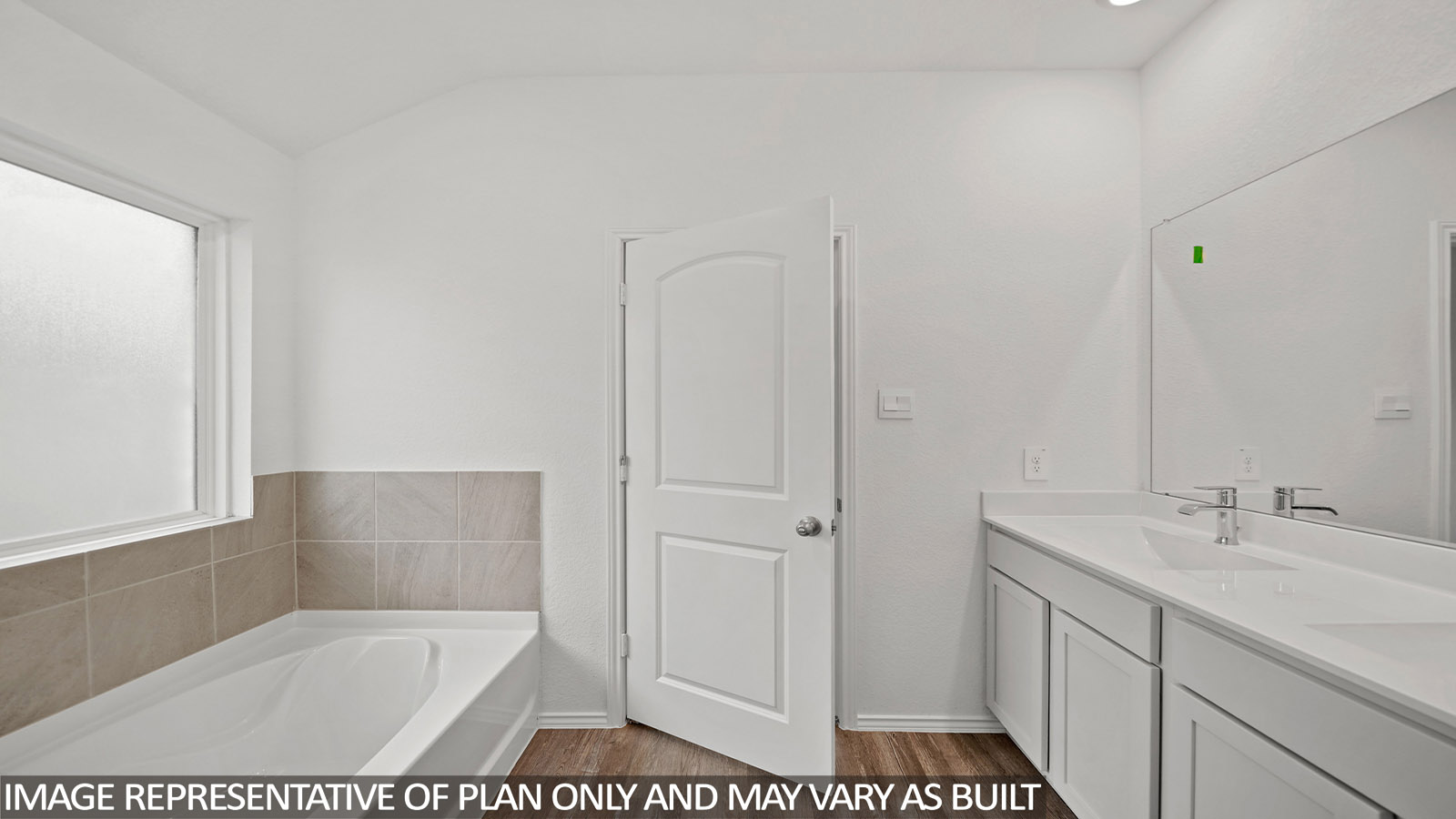 primary bathroom with separate tub and shower