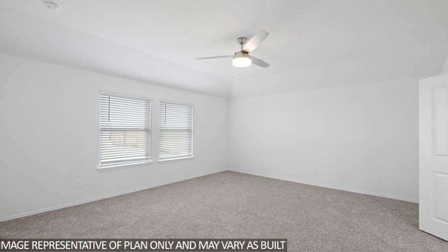 Primary bedroom with bright windows