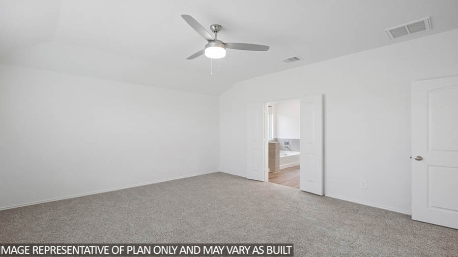 Primary bedroom with carpet flooring