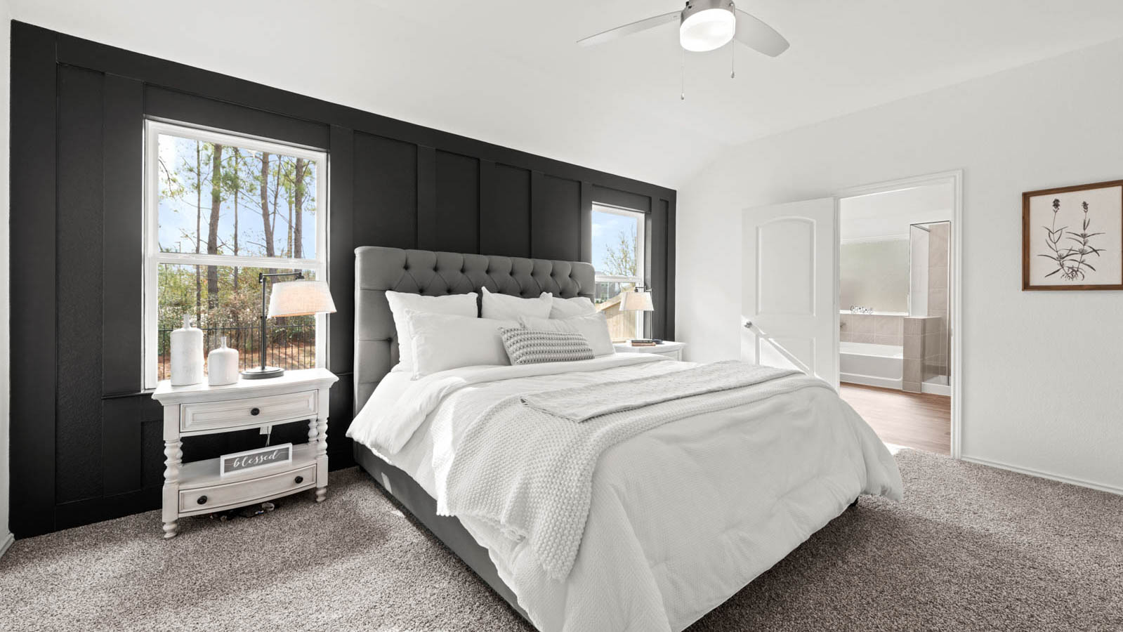 Primary bedroom with carpet flooring