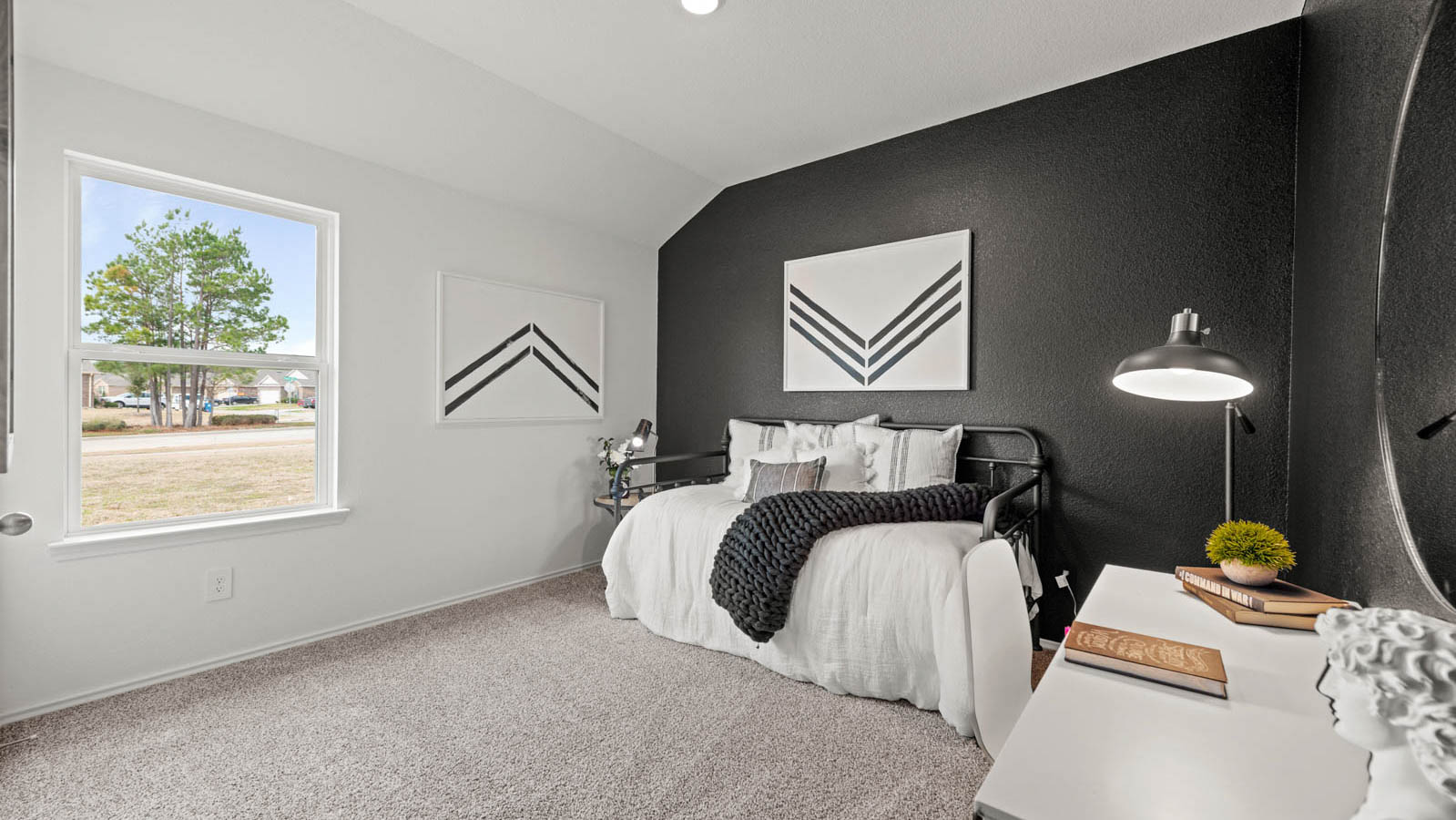 Secondary bedroom with carpet flooring