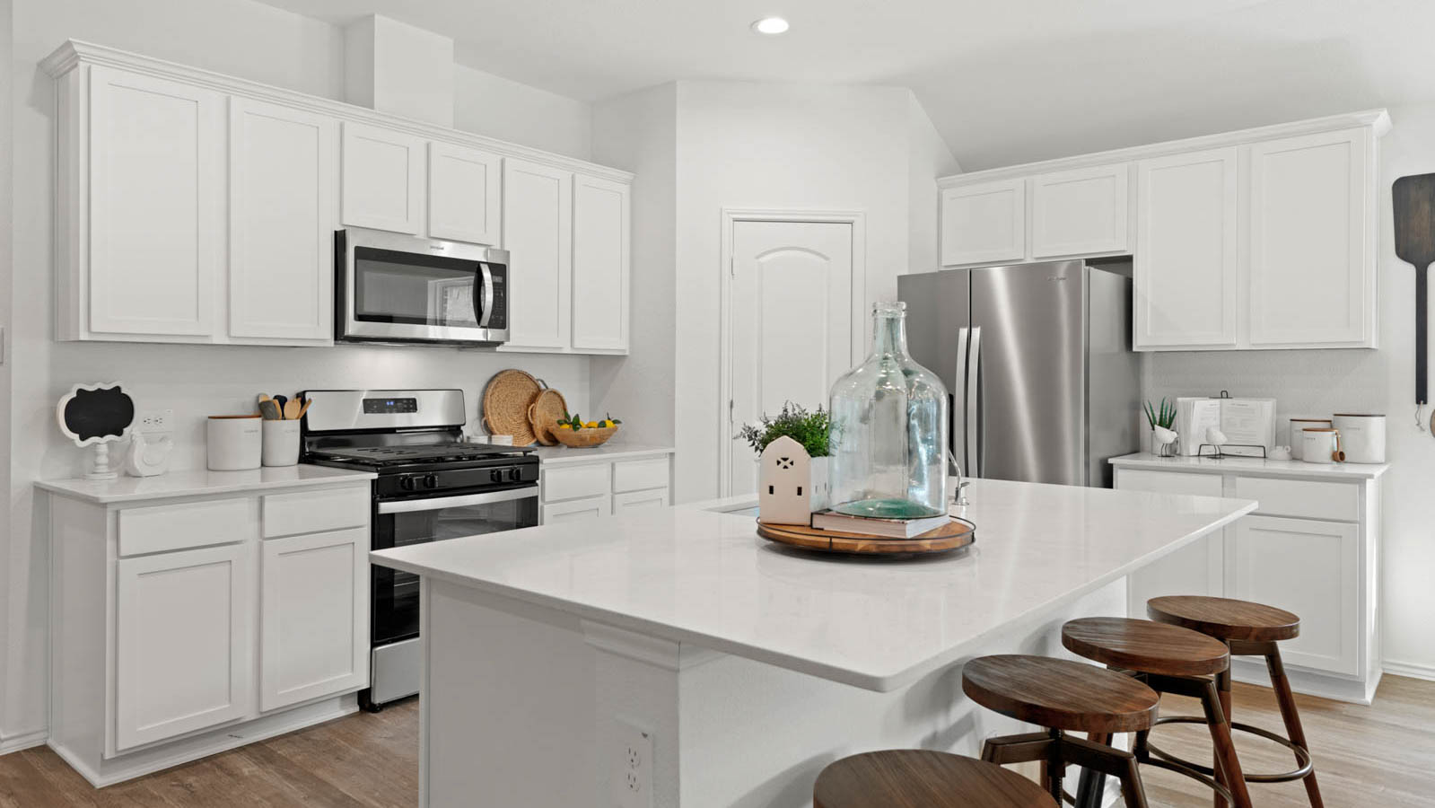Kitchen with an island and vinyl floor
