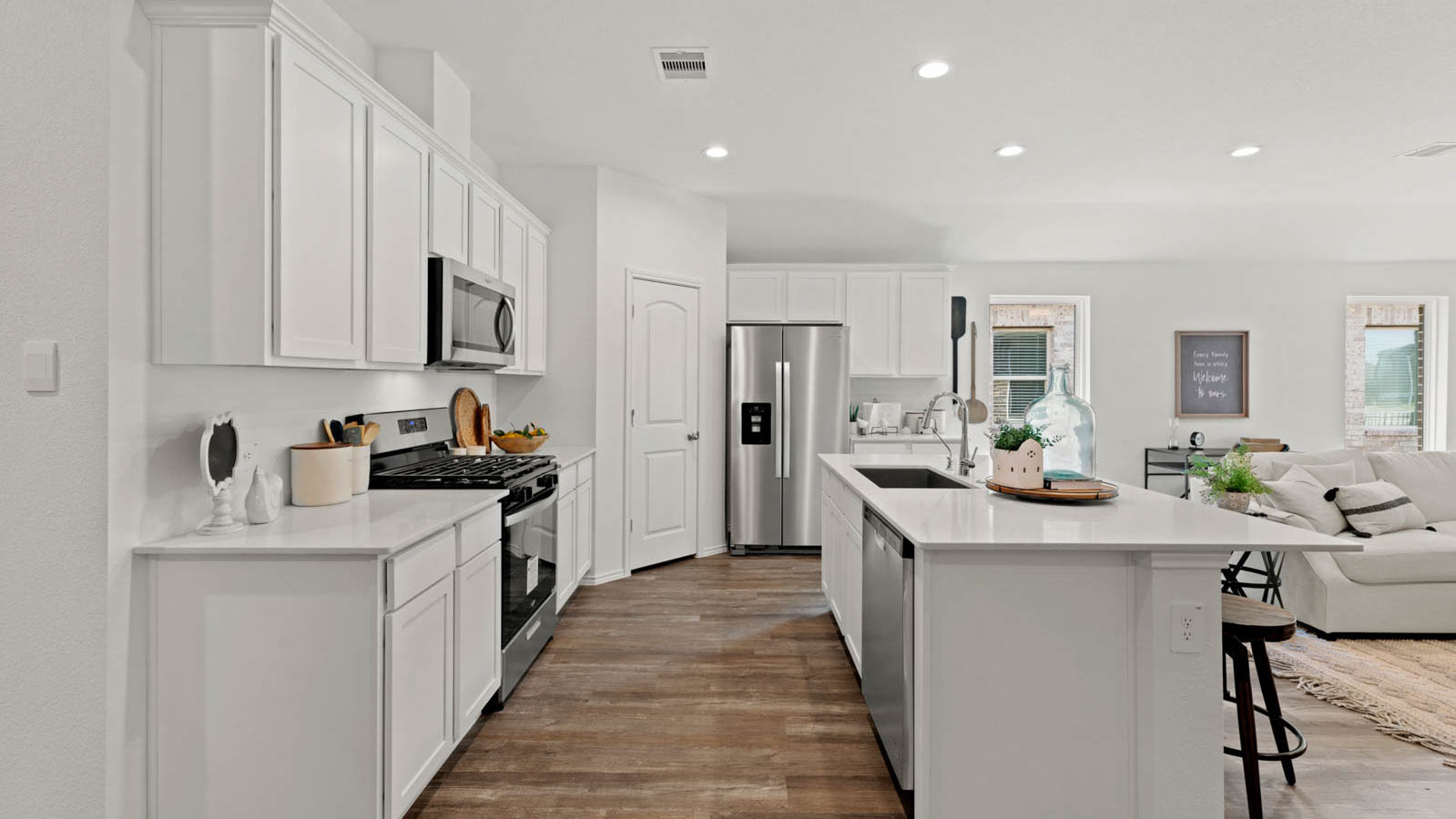 Kitchen with an island and vinyl floor