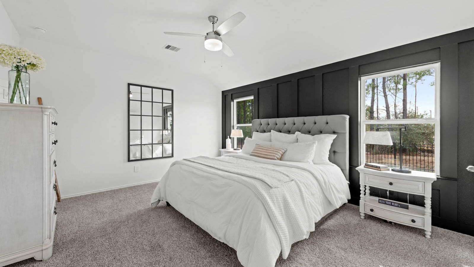 Primary bedroom with carpet flooring
