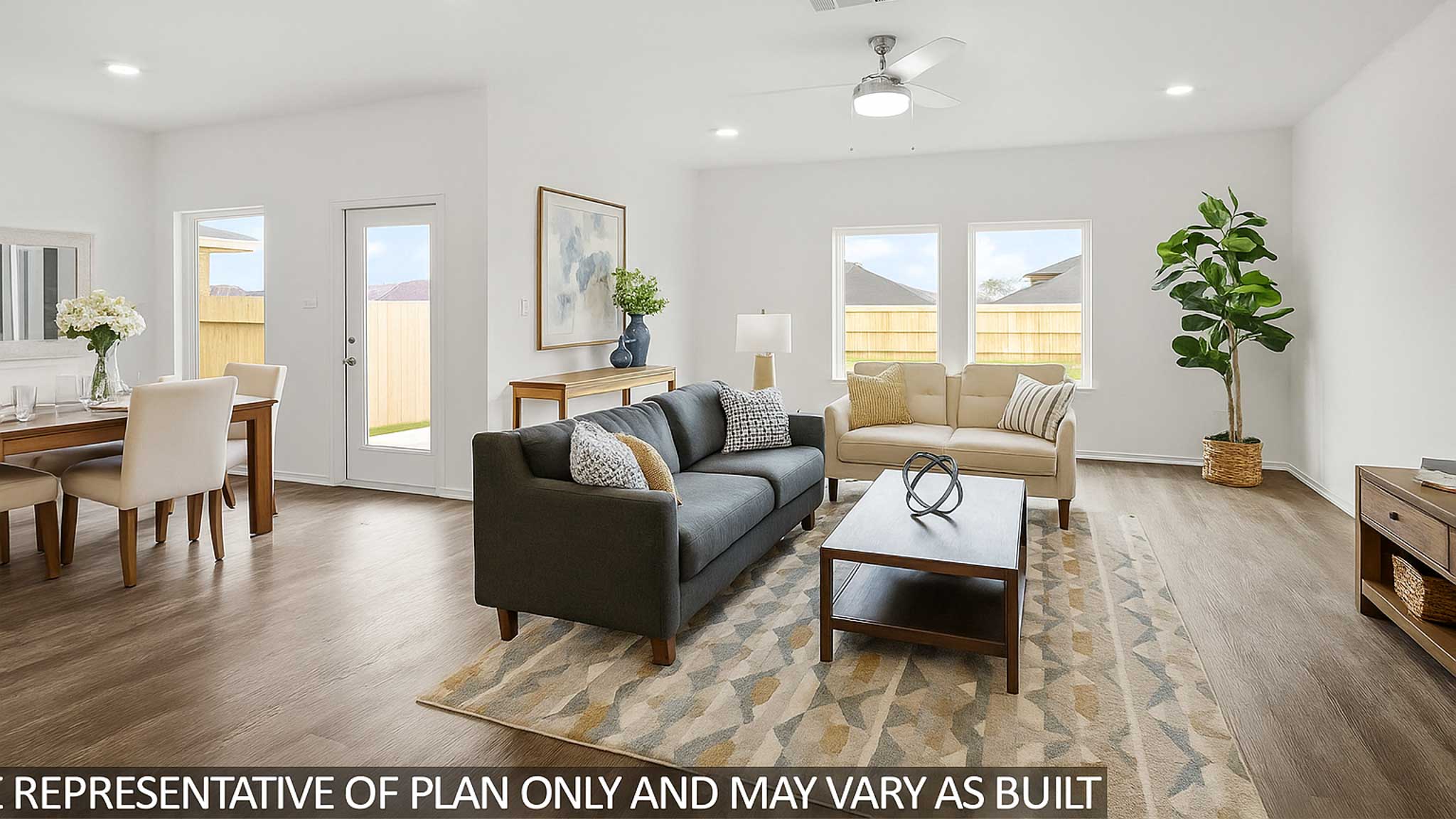 Spacious living area with vinyl flooring