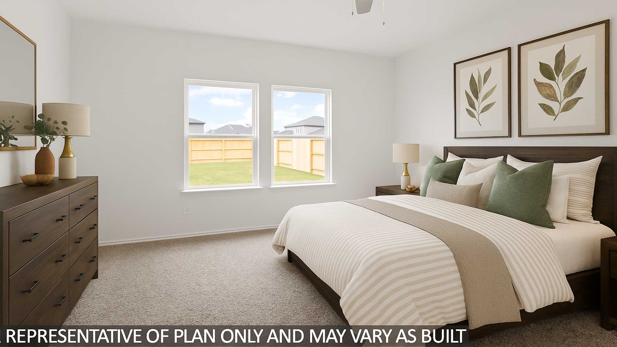 Primary bedroom with bright windows