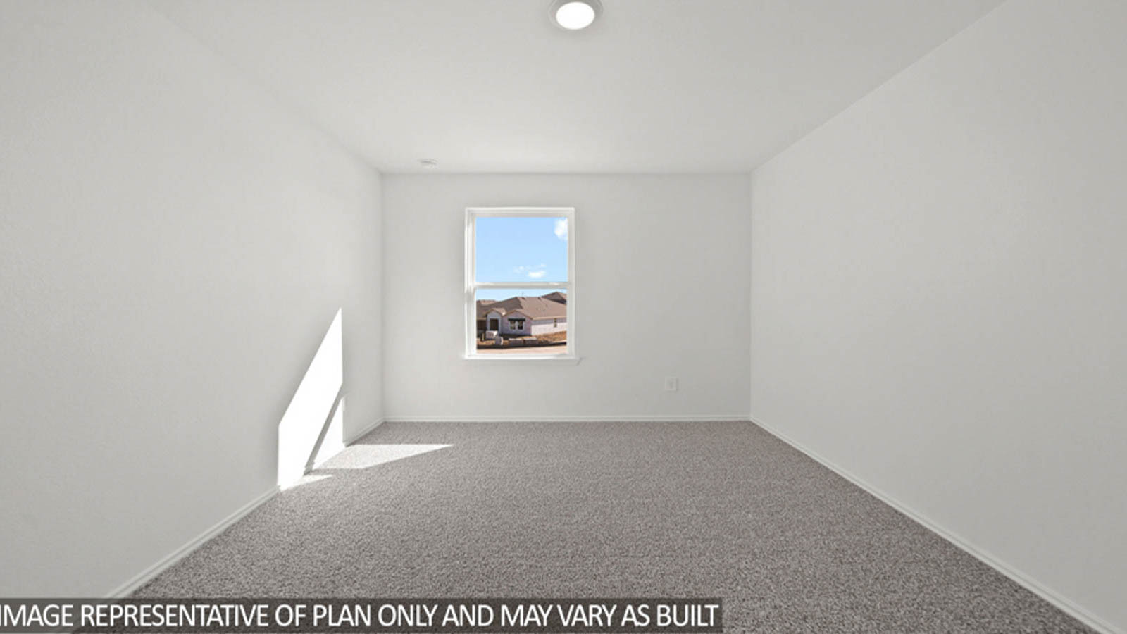 Secondary bedroom with carpet flooring