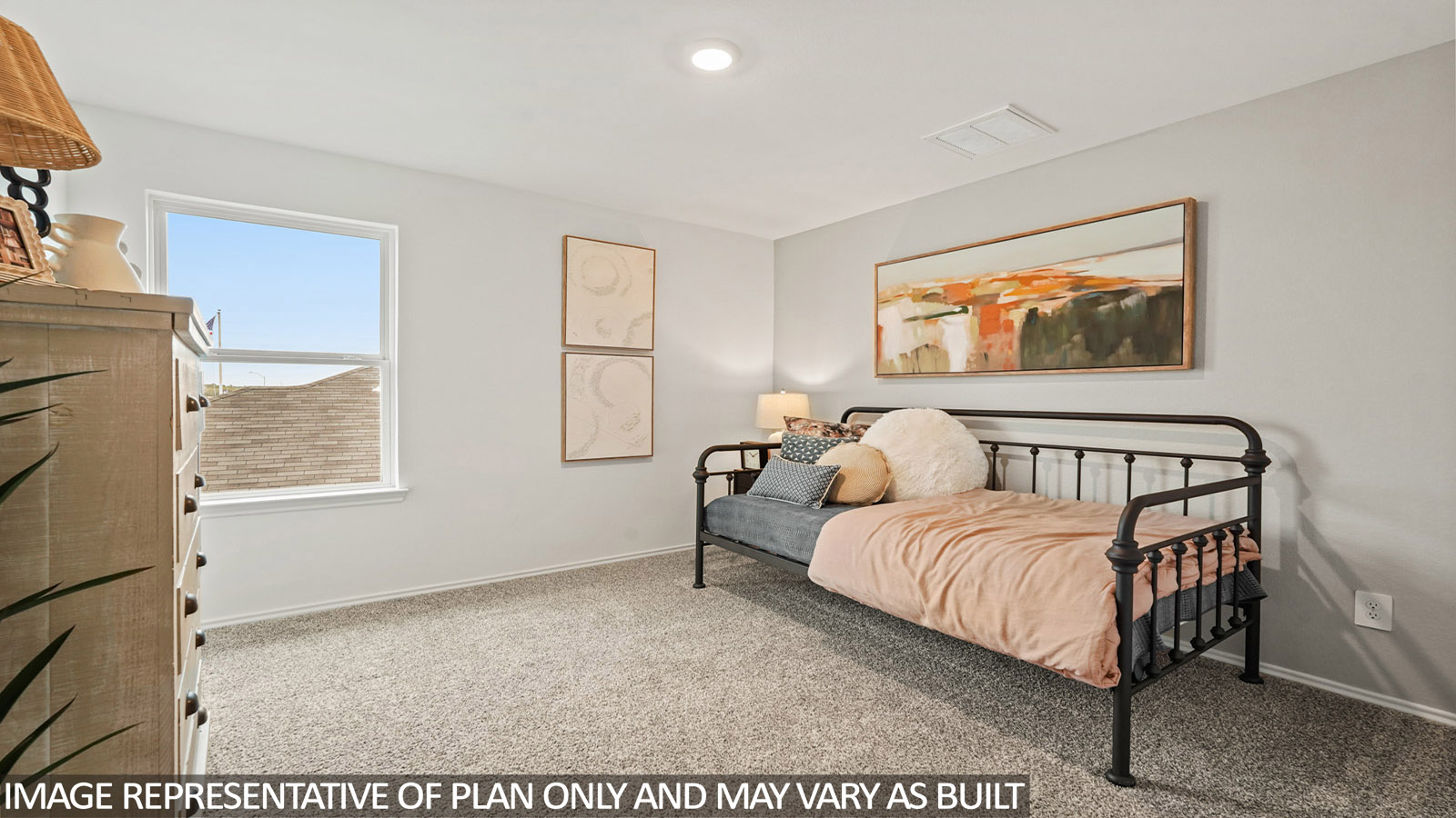 Secondary bedroom with carpet flooring