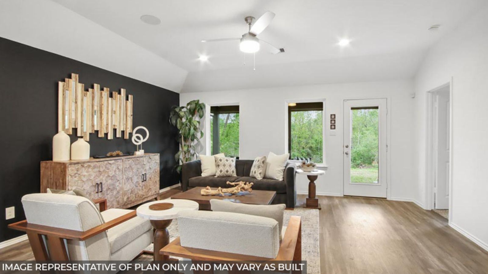 Spacious living area with vinyl flooring