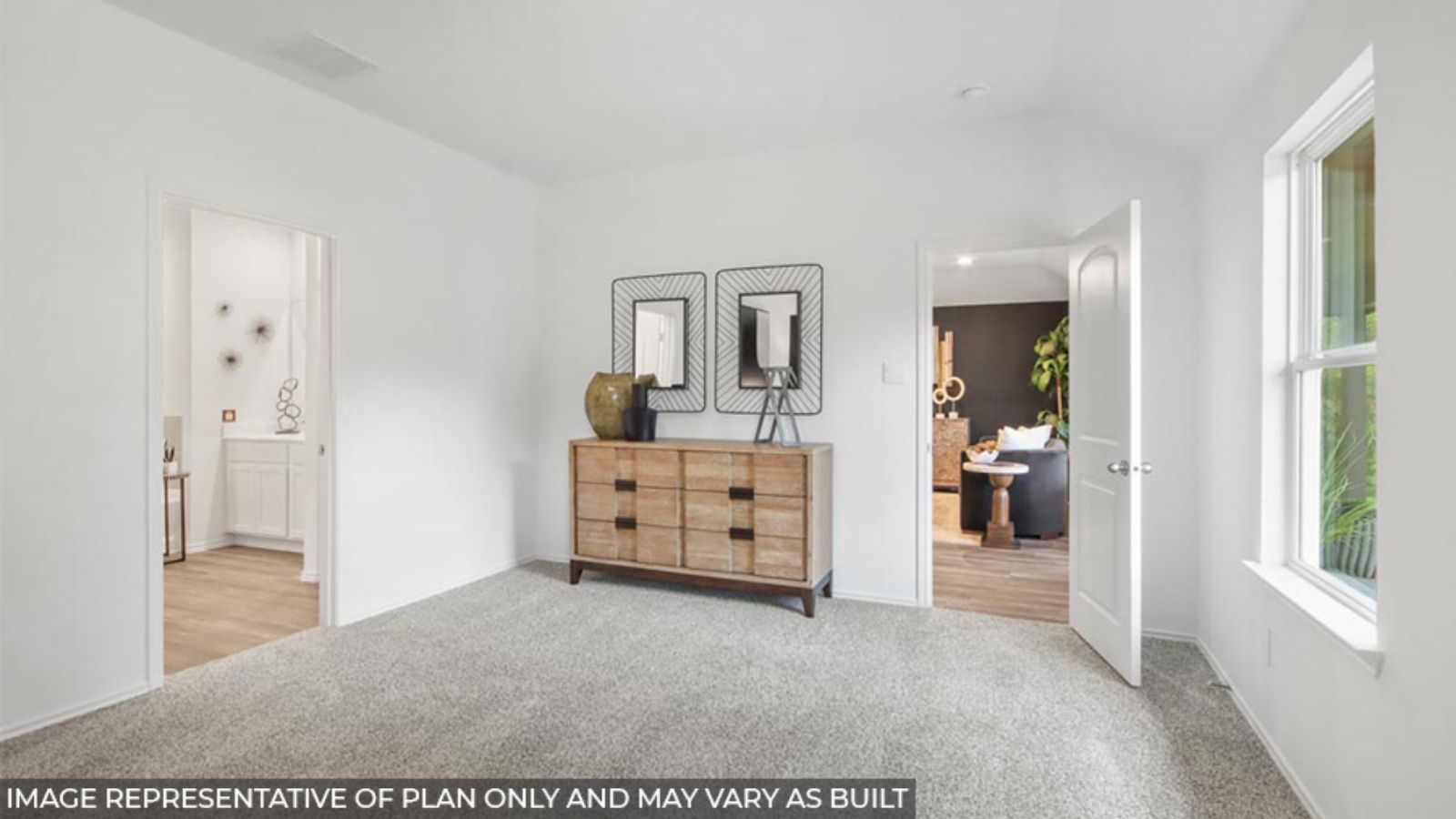 Primary bedroom with bright windows