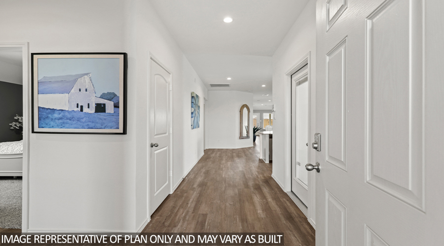 Entryway and foyer with vinyl flooring.