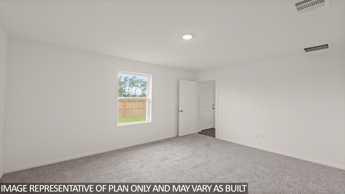 Primary bedroom with bright windows