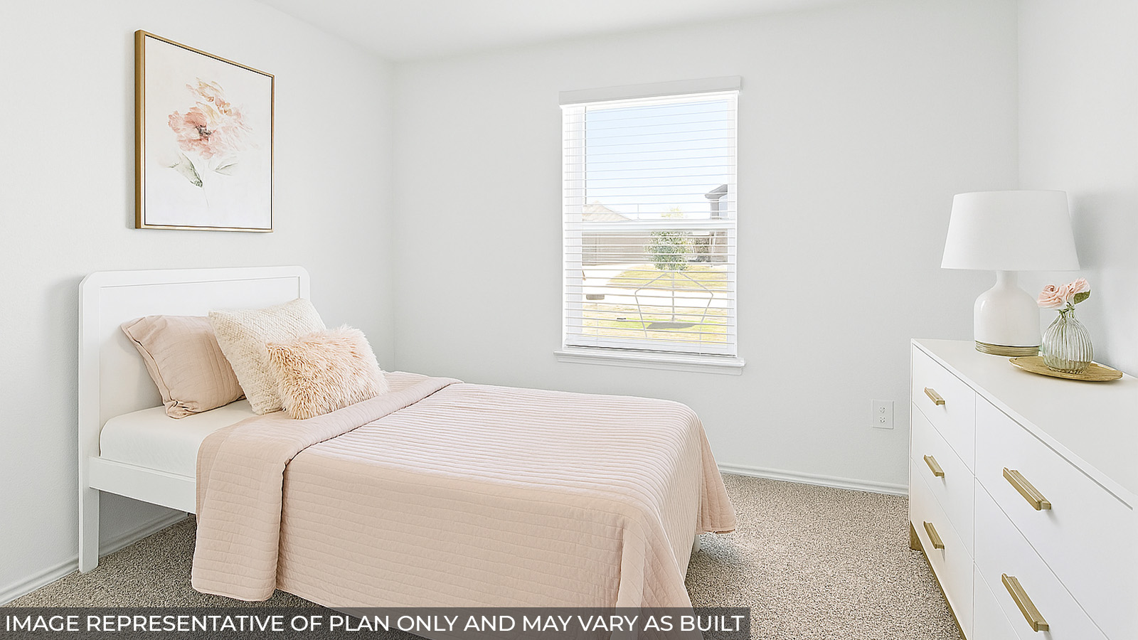 Staged secondary bedroom with carpet flooring and a bright window.