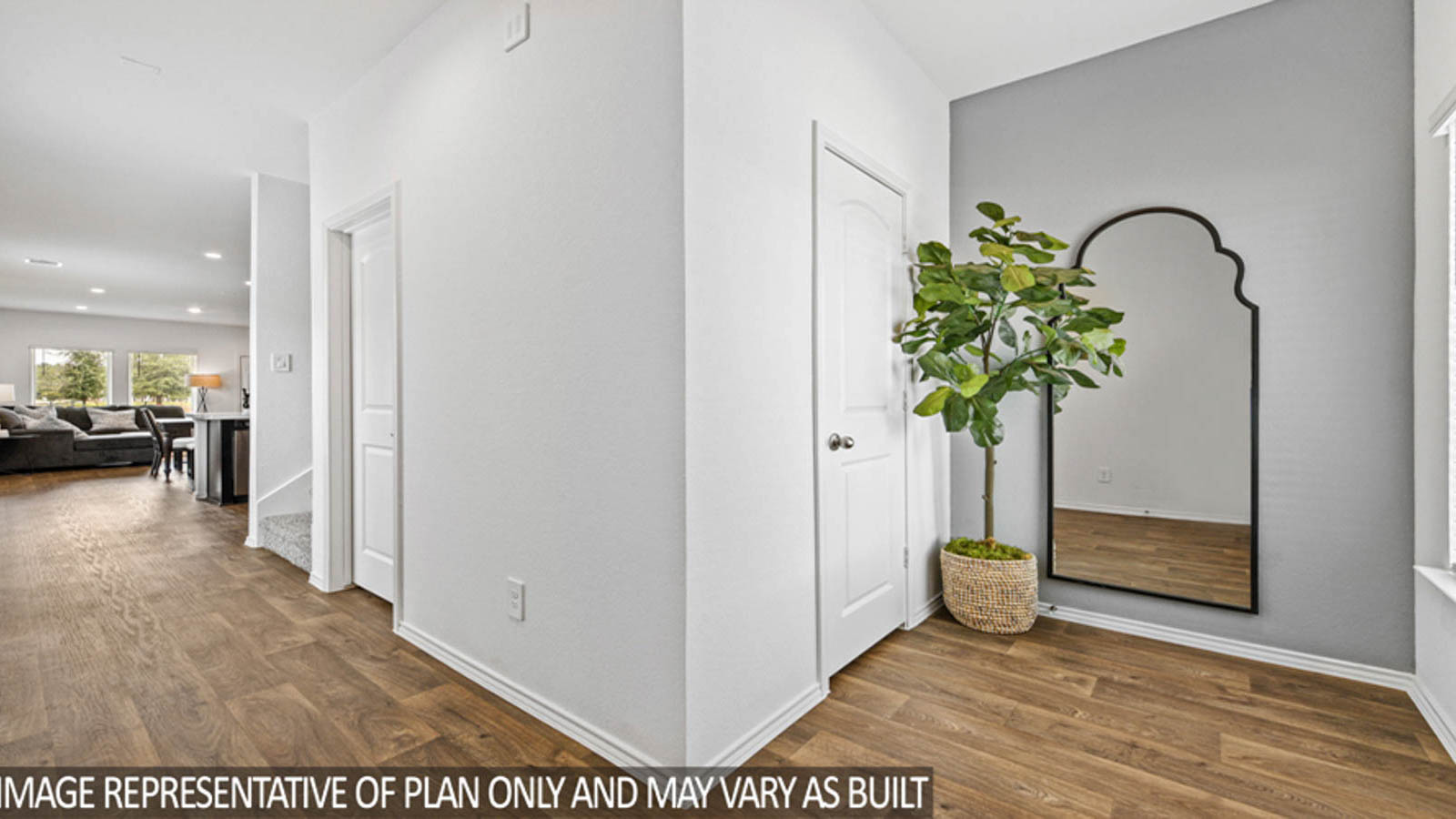 Entryway and foyer with vinyl flooring.