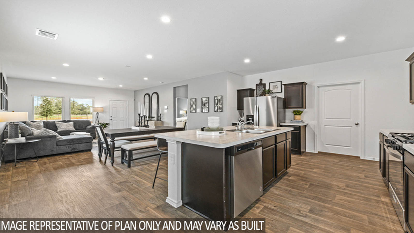 Kitchen with an island and stainless-steel appliances.