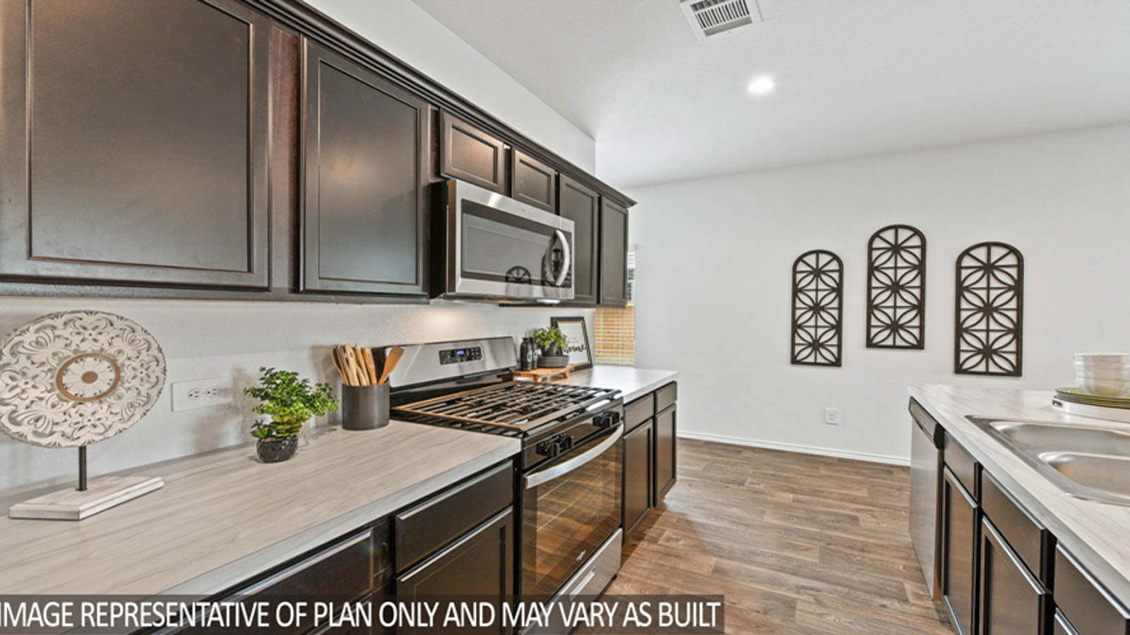 Kitchen with an island and stainless-steel appliances.