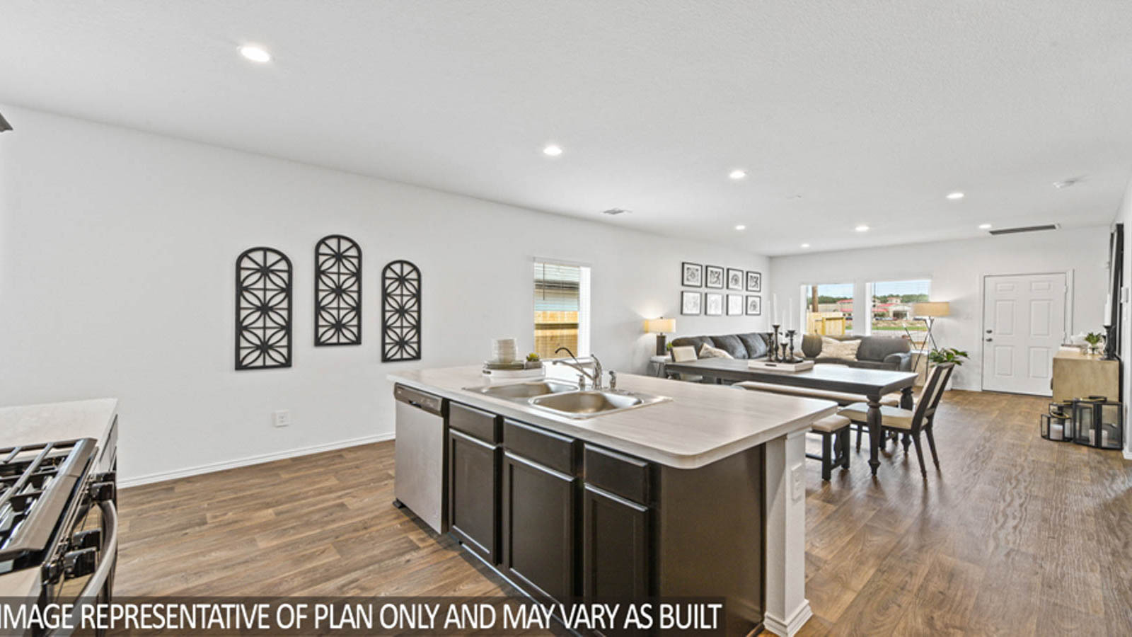 Kitchen with an island and stainless-steel appliances.