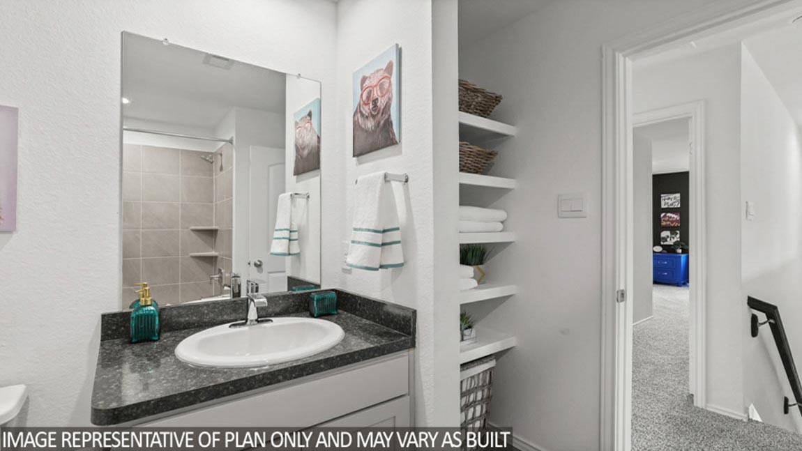 Secondary bathroom with a linen nook.