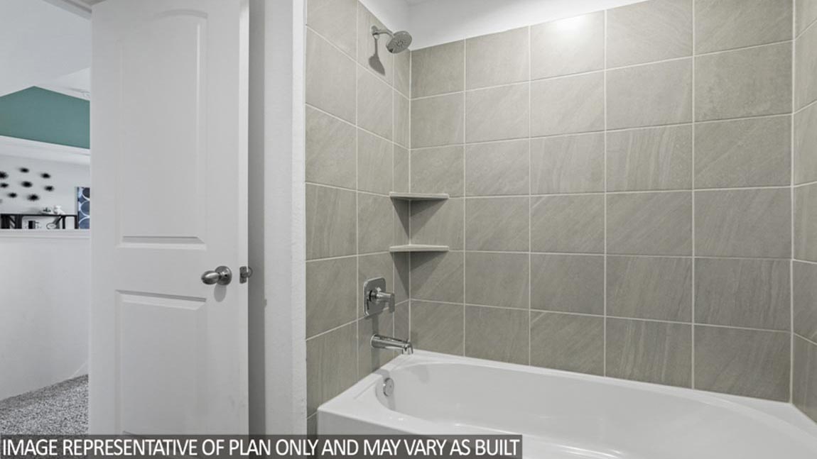 Secondary bathroom with a tile tub/shower combo.