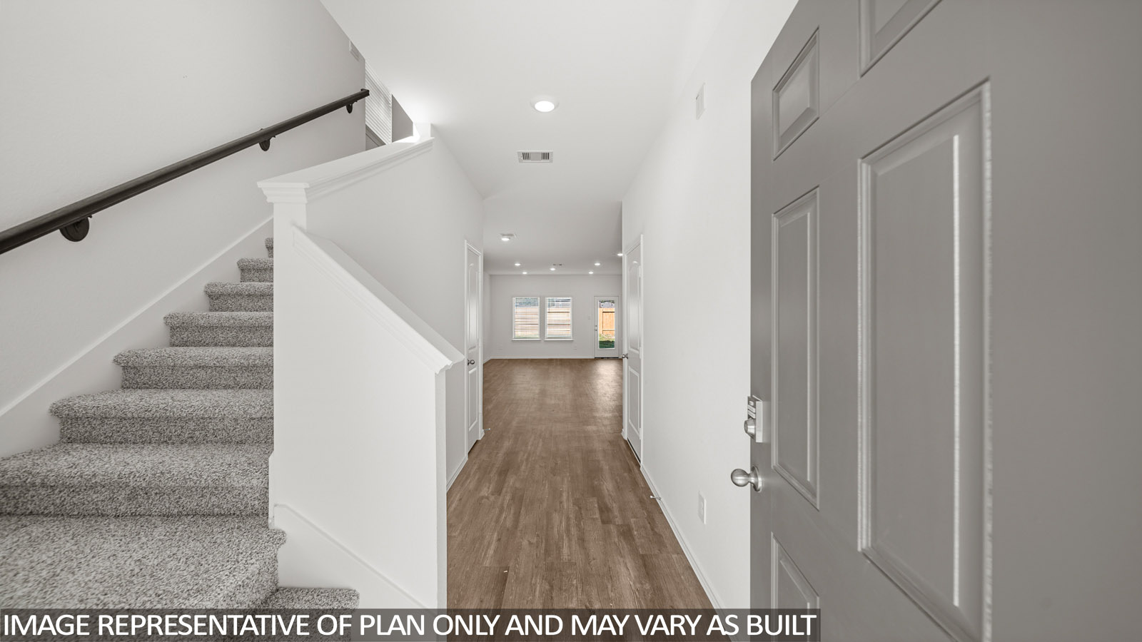 Entryway and foyer with vinyl flooring.