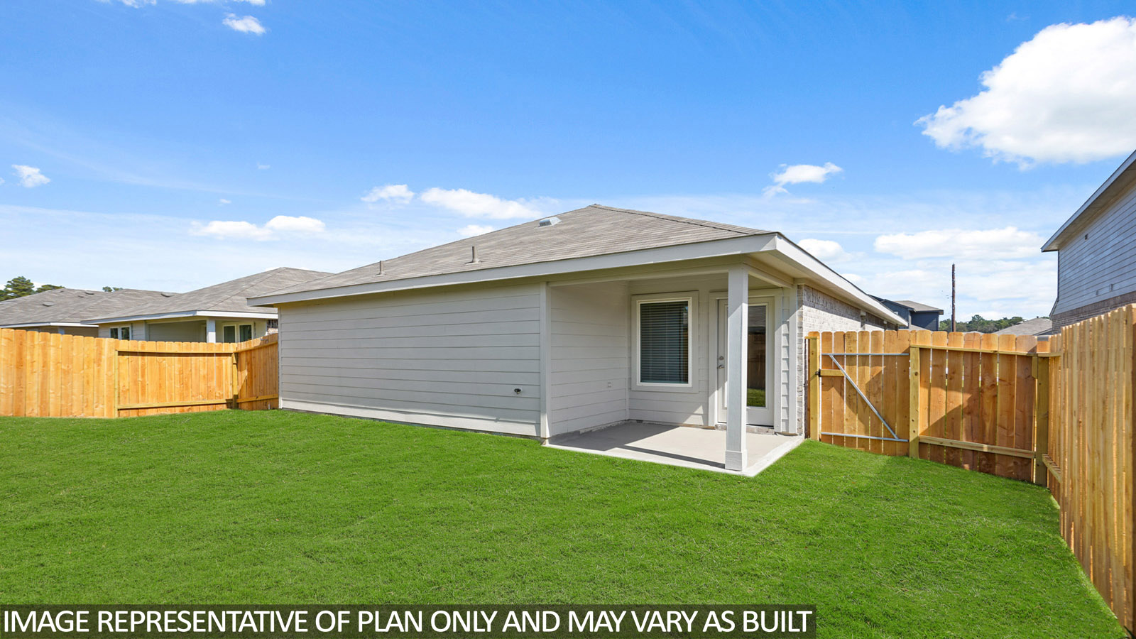 Spacious backyard with patio.
