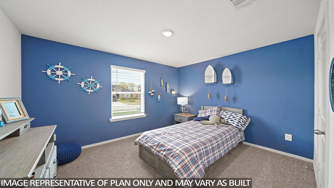 Secondary bedroom with carpet flooring