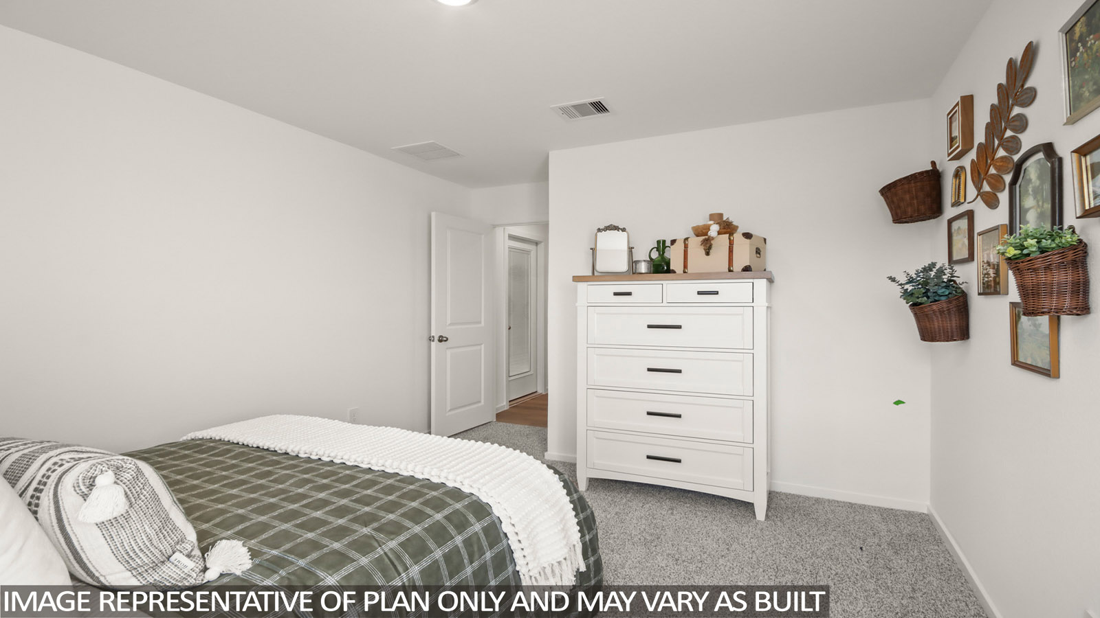 Secondary bedroom with carpet flooring
