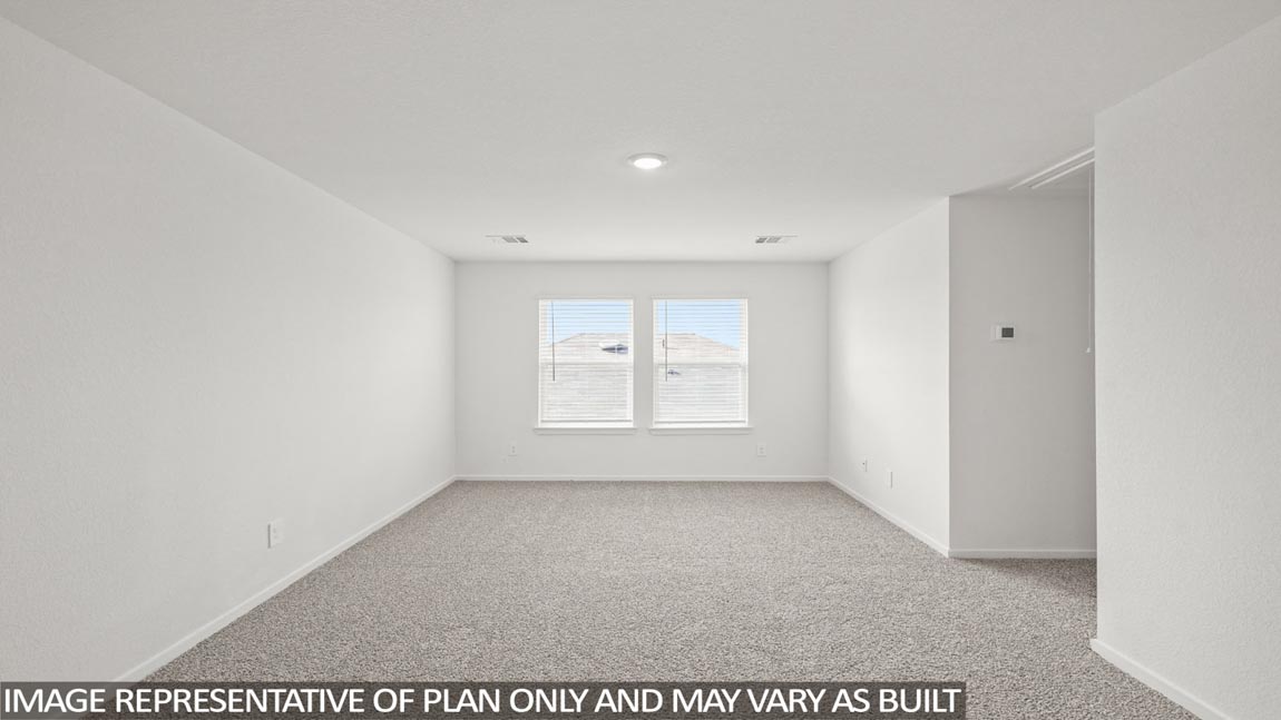 Second story game room with carpet flooring