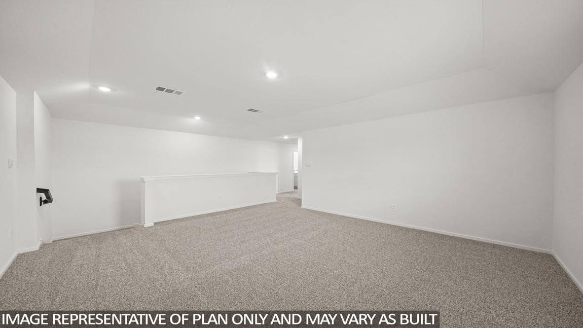 Second story game room with carpet flooring