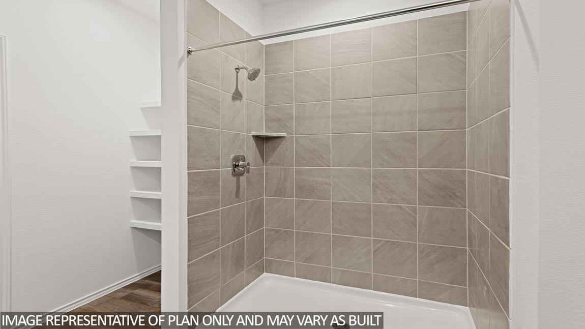 Primary bathroom with shower and linen storage