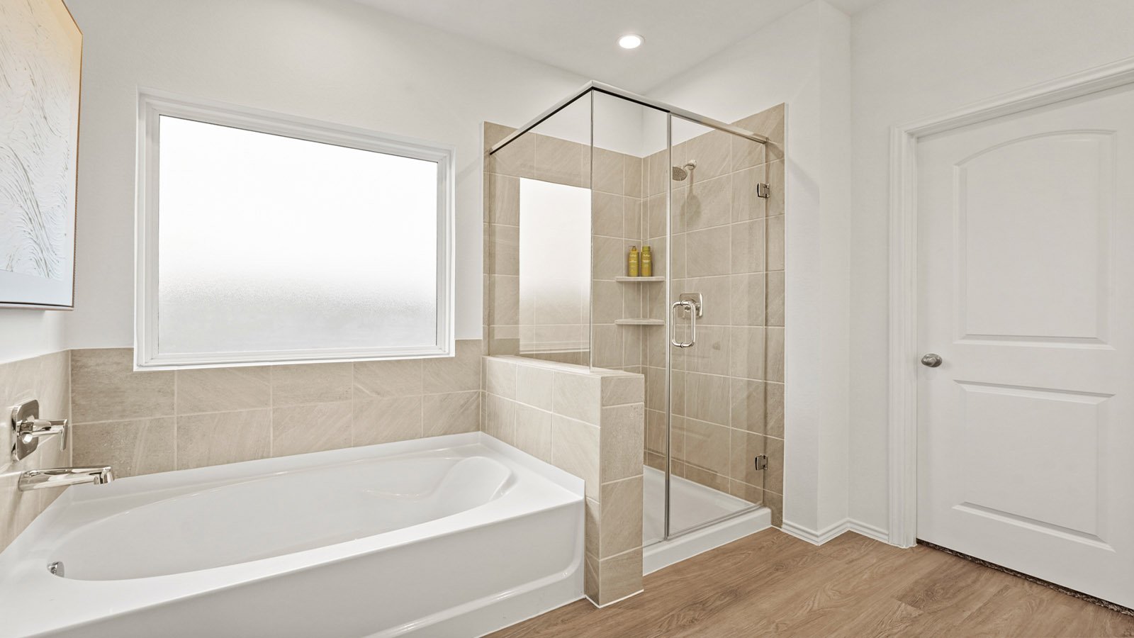 primary bathroom with tile tub and shower