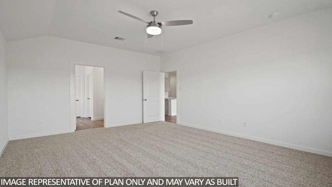Primary bedroom with carpet flooring