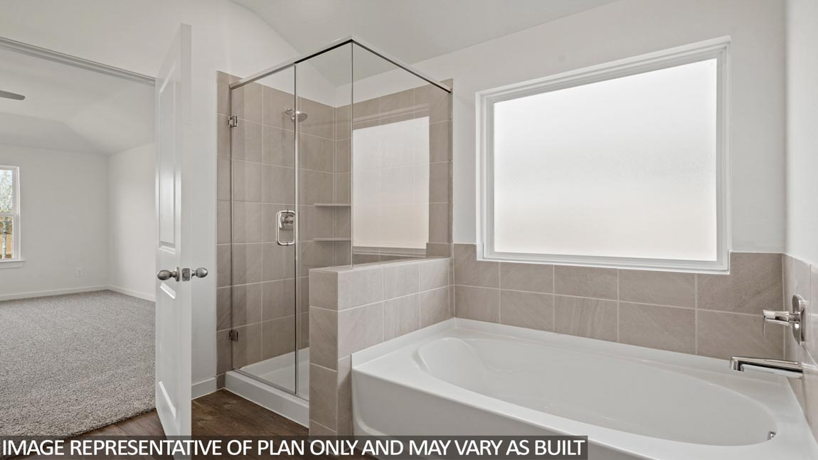 Primary bathroom with tub and shower