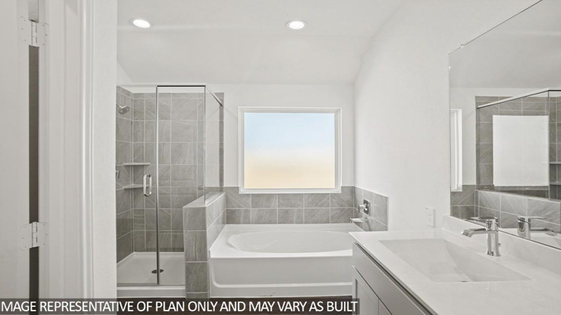 Primary bathroom with tub and shower