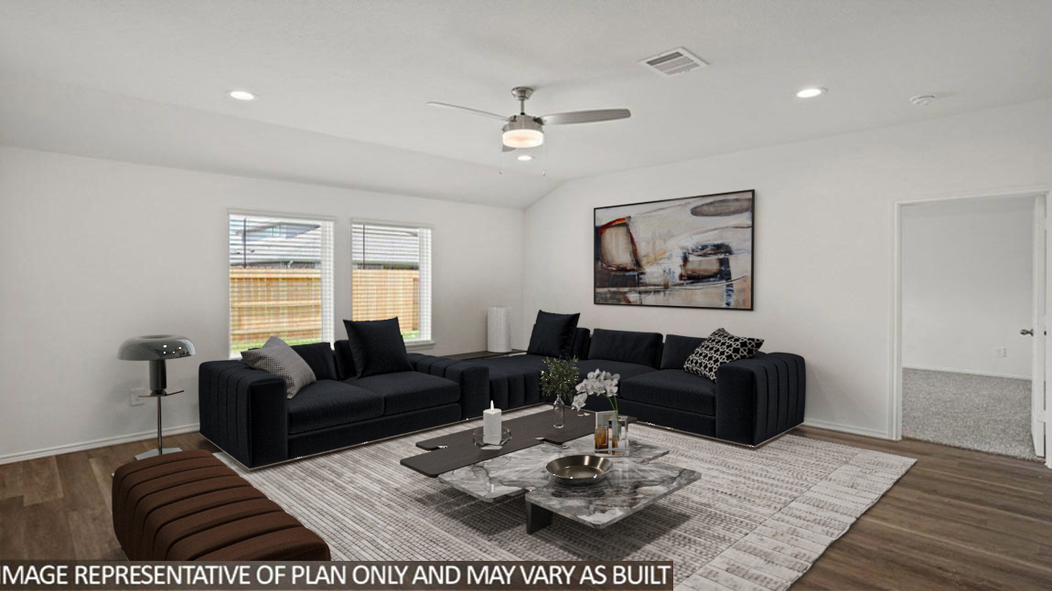 Spacious living area with vinyl flooring
