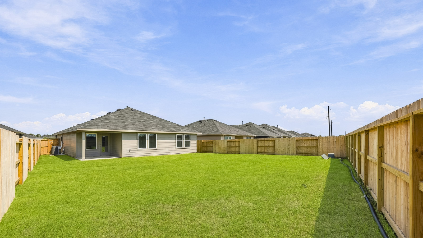 covered patio with overhead lighting