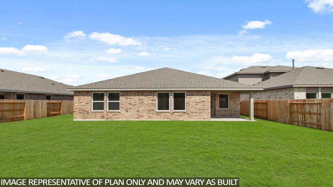 Spacious backyard with patio.