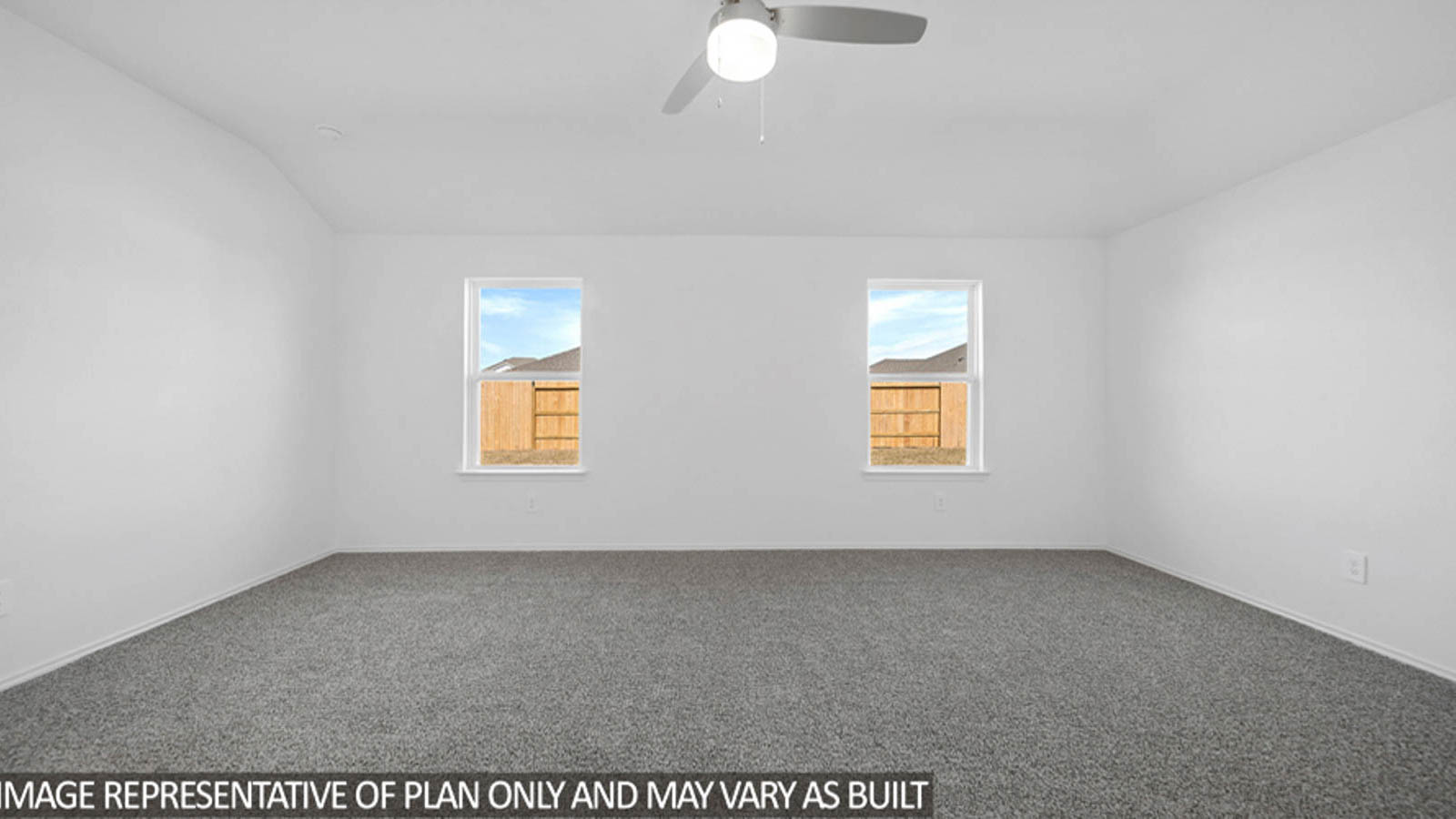 Primary bedroom with carpet flooring