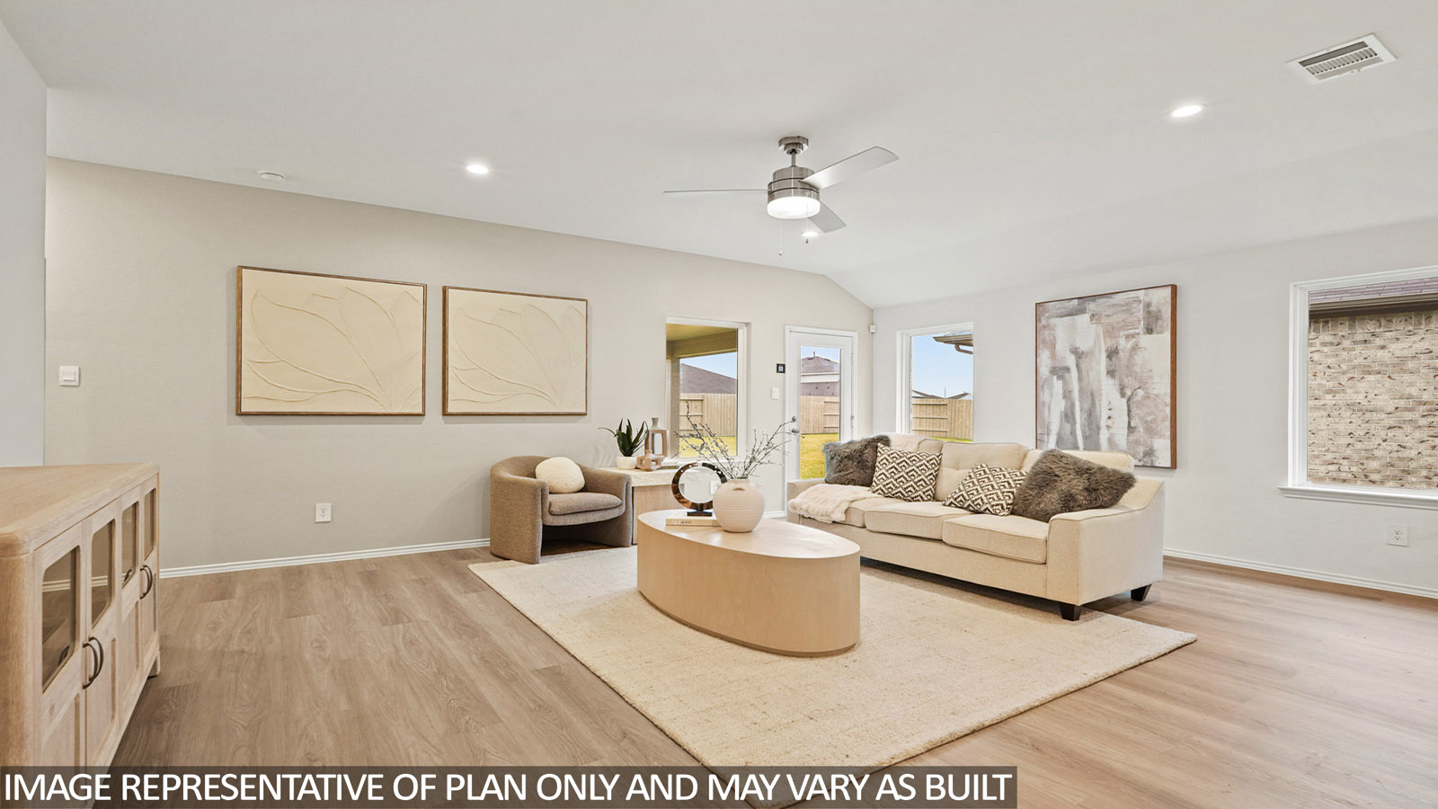 Spacious living area with vinyl flooring