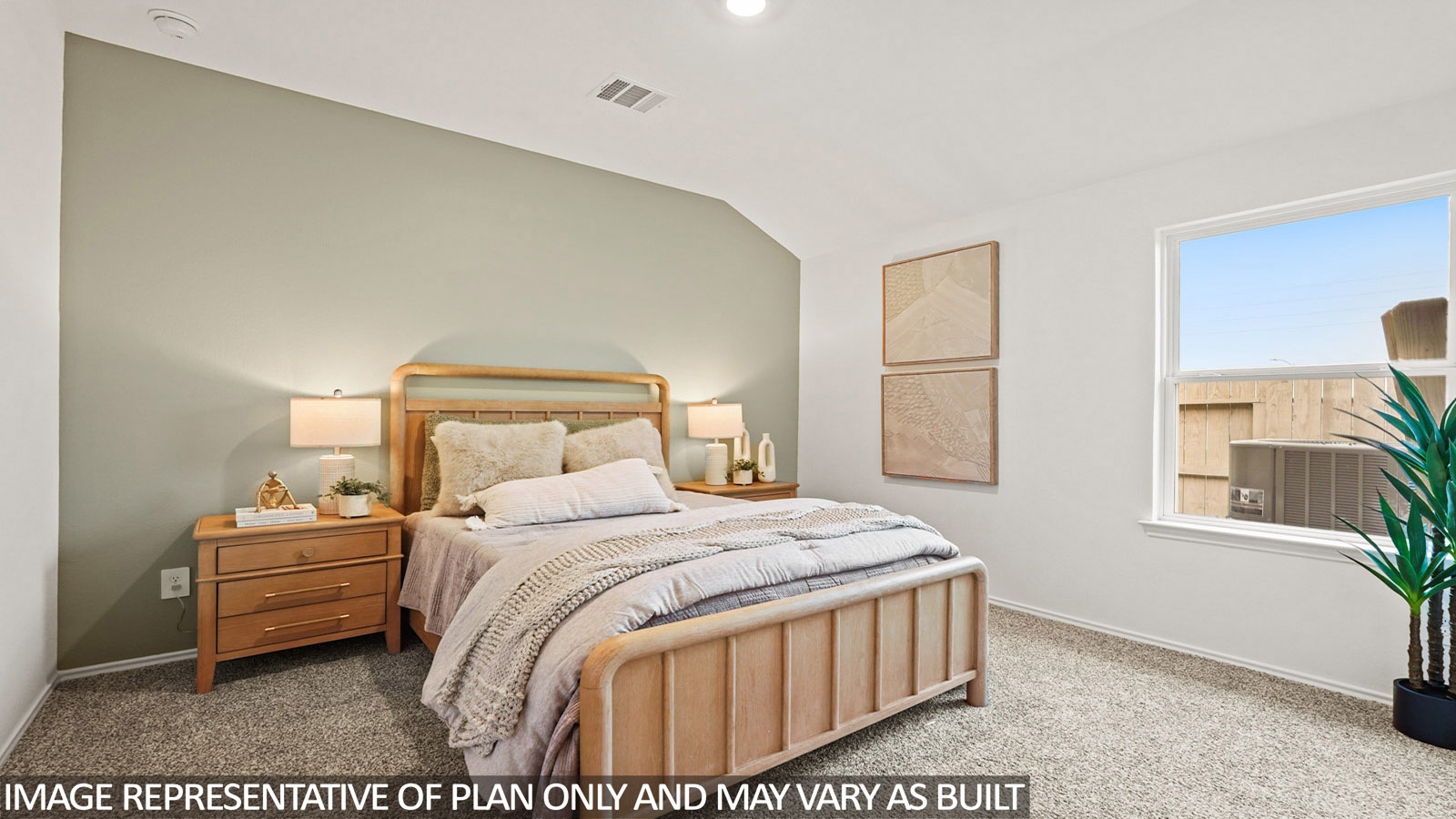 Secondary bedroom with carpet flooring