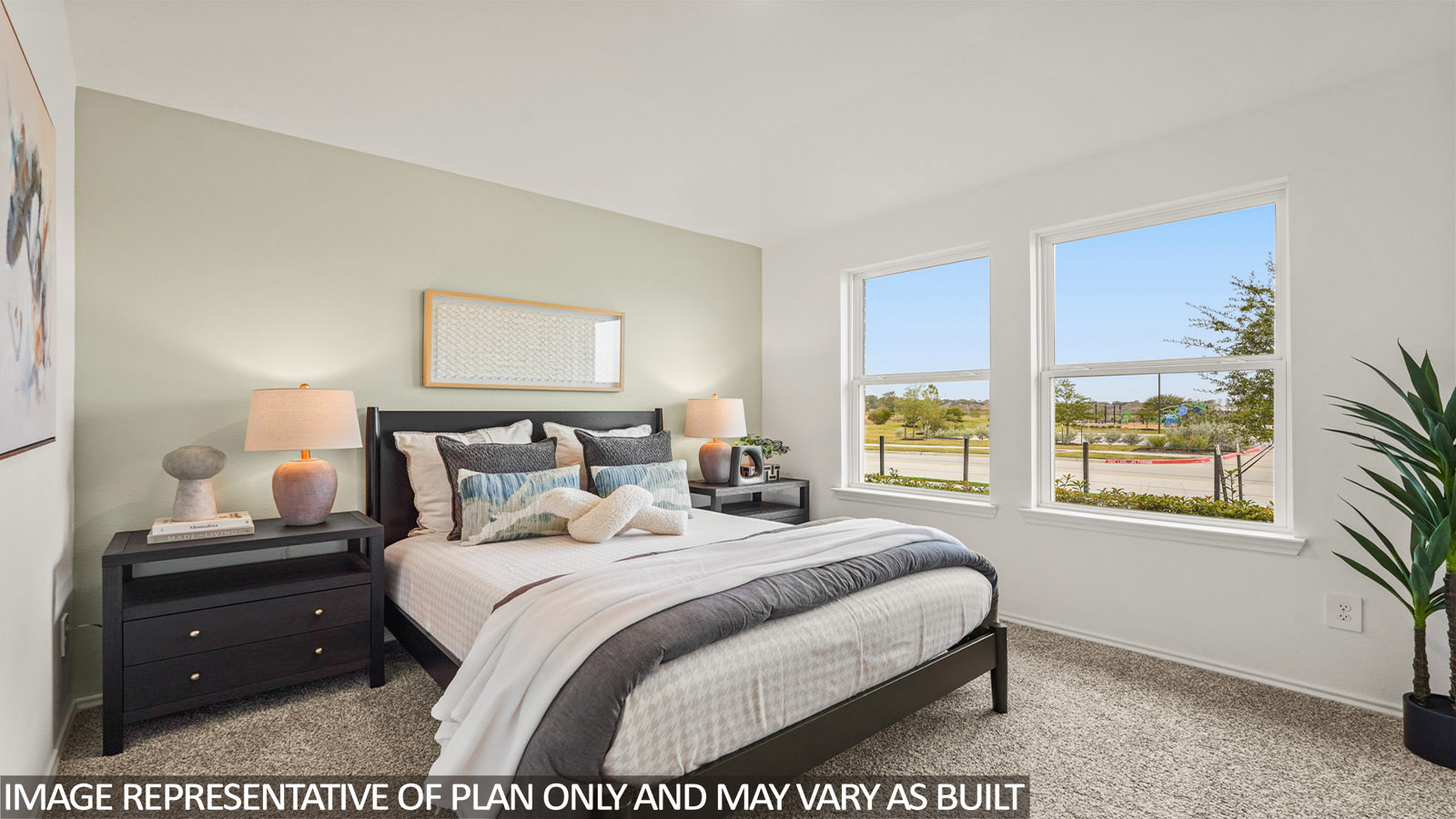Secondary bedroom with carpet flooring