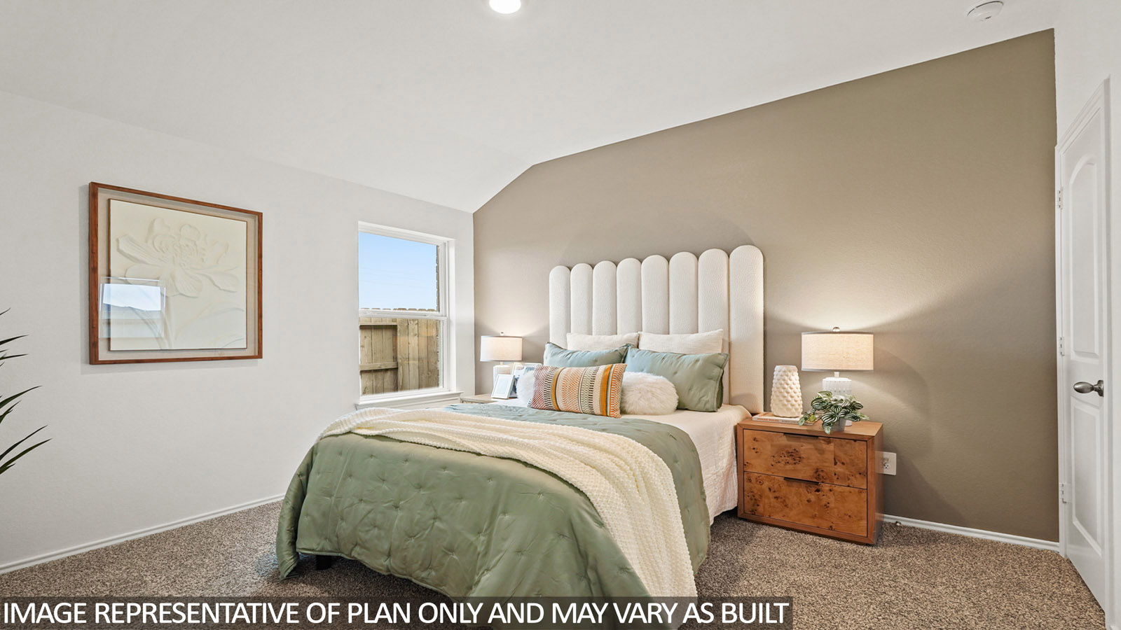 Secondary bedroom with carpet flooring