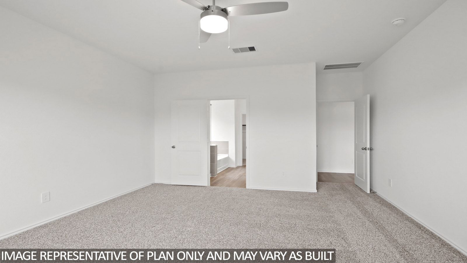Primary bedroom with carpet flooring
