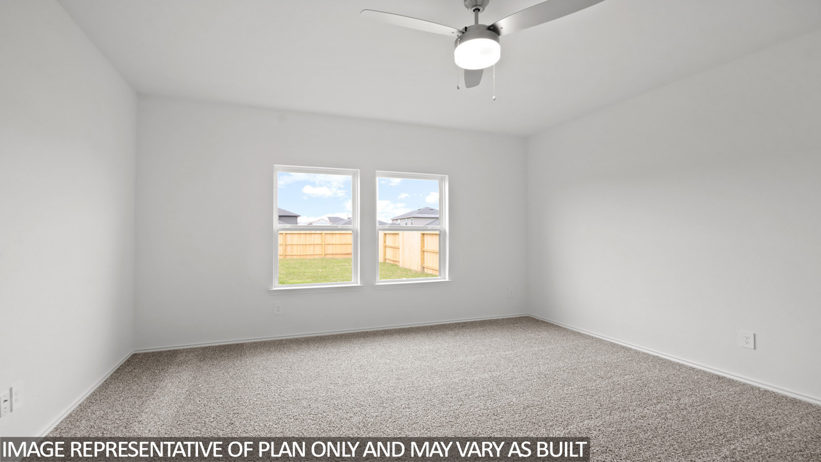 Primary bedroom with bright windows