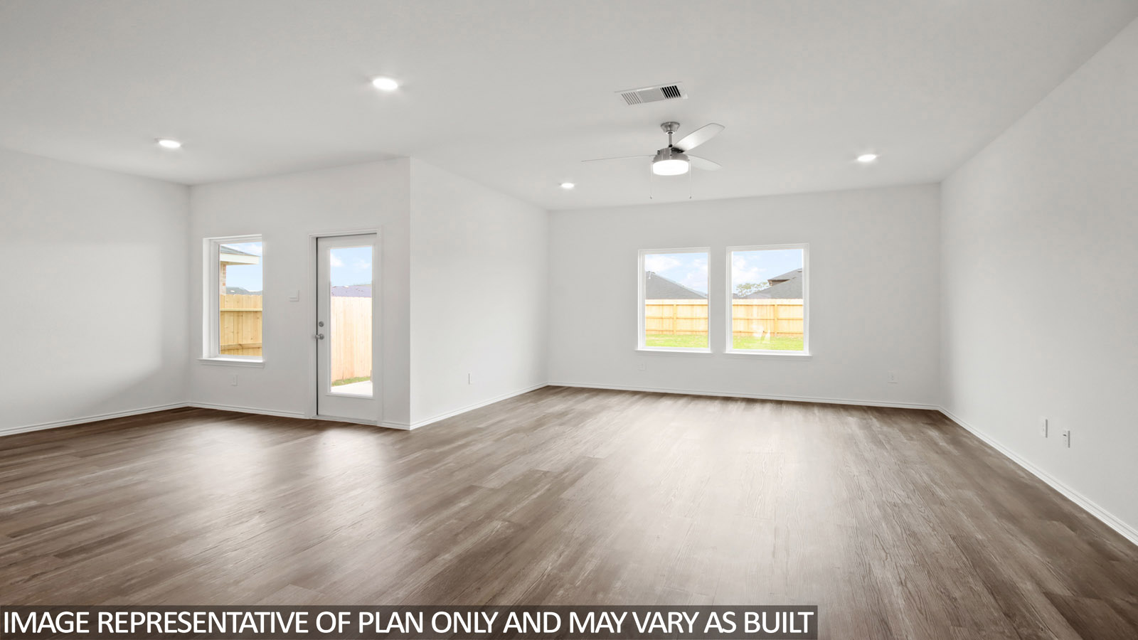 Open concept living and dining area with vinyl flooring and bright windows.