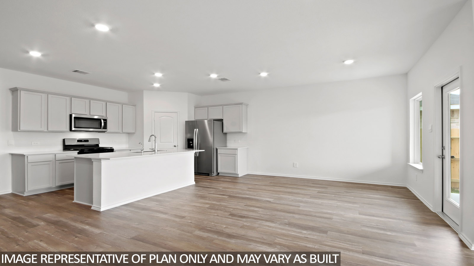 Open concept living and dining area with vinyl flooring.