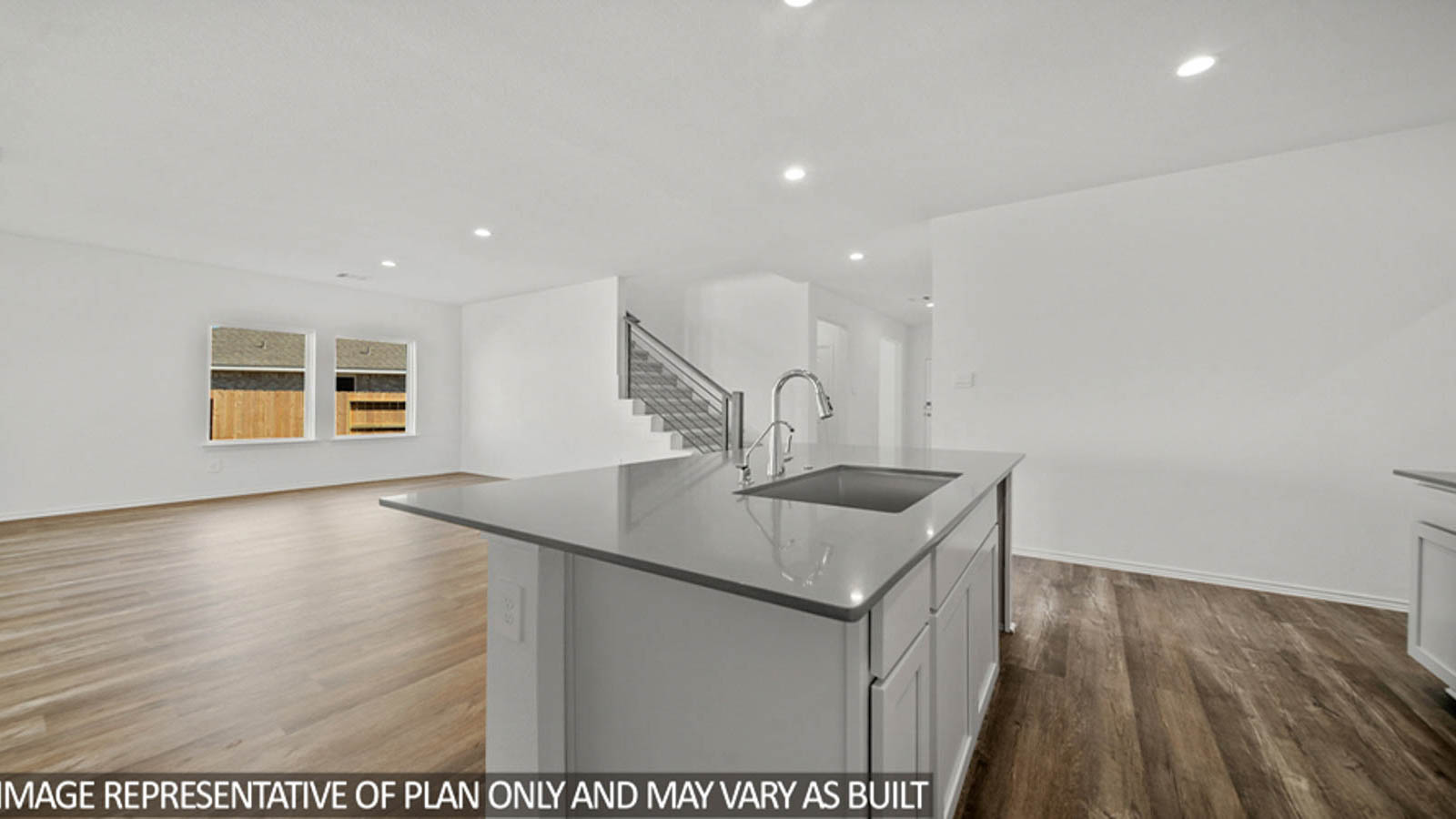 Kitchen with an island and vinyl floor