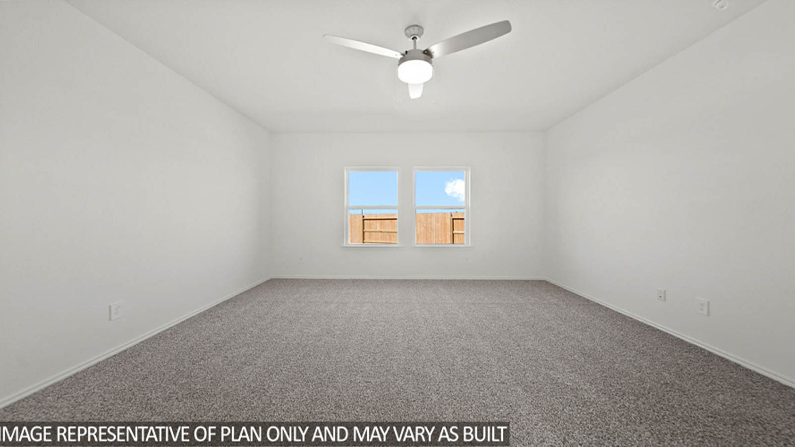 Primary bedroom with carpet flooring